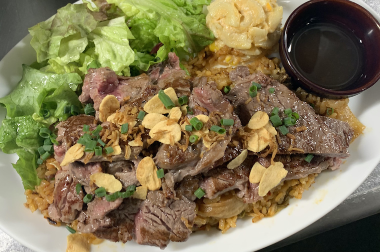 Garlic rice and angus beef steak on top