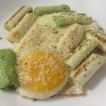 Grilled green onion with sunny side up egg on top