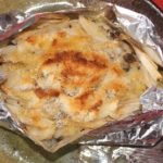 Grilled chicken and mushroom wrapped by tin foil and grilled with bread crumbs on top