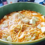 Ramen noodle with mapo tofu soup in a green bowl