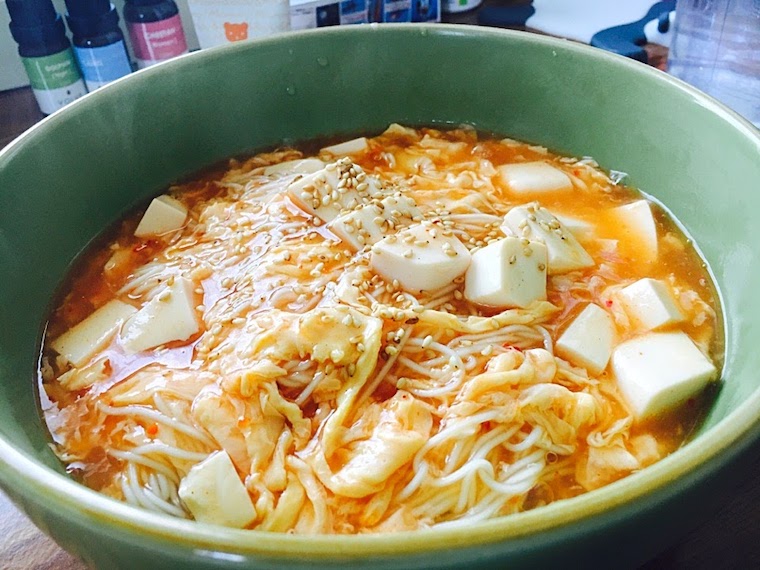 Ramen noodle with mapo tofu soup in a green bowl