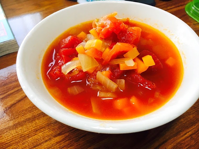 Minestrone Soup with onion, carrots, bell peppers, celery in it.