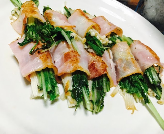 Enoki mushroom and mustard greens wrapped by cooked bacon