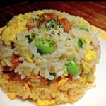 Regular fried rice on top of kimchi fried rice as tower.