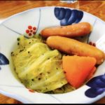 Cooked ground meat wrapped by cabbage leaves. Served with cooked weiner and carrots.