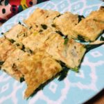 Sliced Korean pancakes on a blue plate