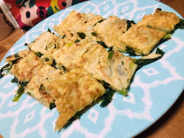 Sliced Korean pancakes on a blue plate