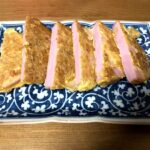 6 pieces ham piccatas in a blue plate.