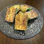 Grilled Zucchini Steak on Black Plate